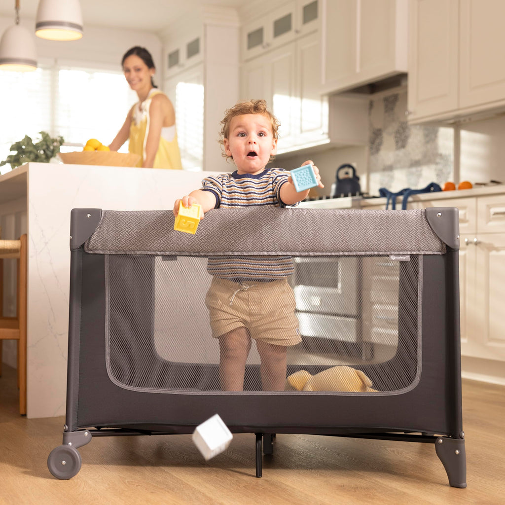 4-in-1 Portable Play Yard with Bassinet and Changer C248062